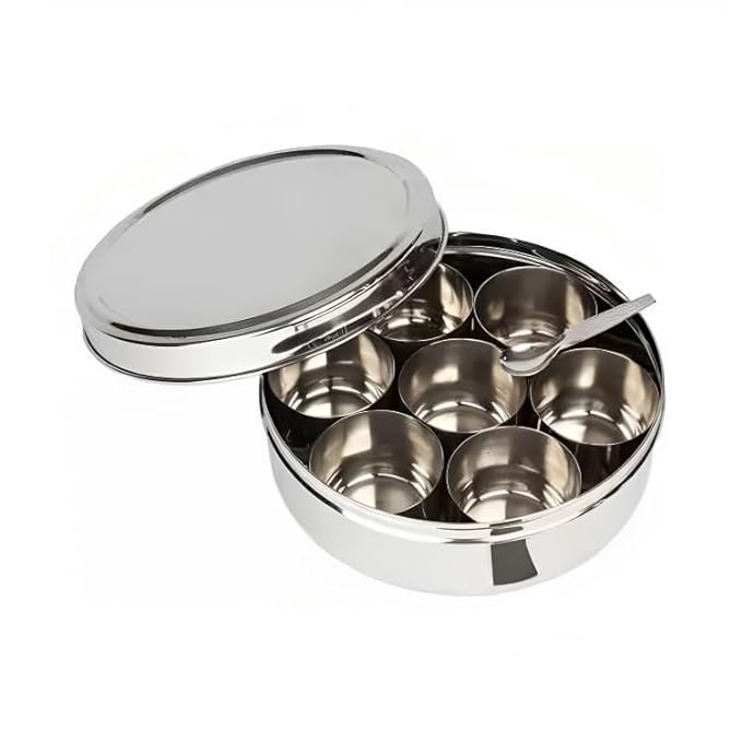 Mumma’s LIFE stainless steel masala box with glass lid”2. “Transparent lid spice box organizer”3. “7-compartment glass top masala dabba”4. “Rust-proof kitchen masala box viewable lid”5. “Food-grade steel masala container with spoon